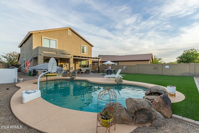 view of pool featuring a patio area and a lawn