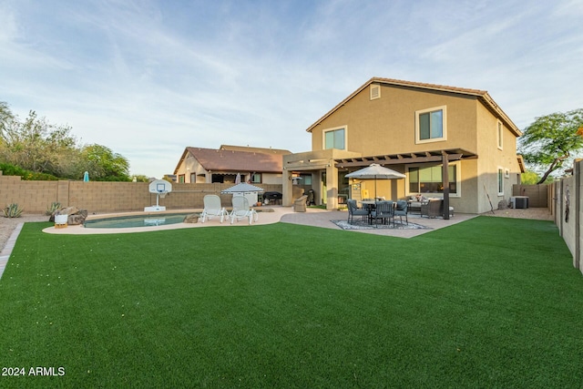 rear view of house featuring a fenced in pool, central AC, a patio area, and a lawn