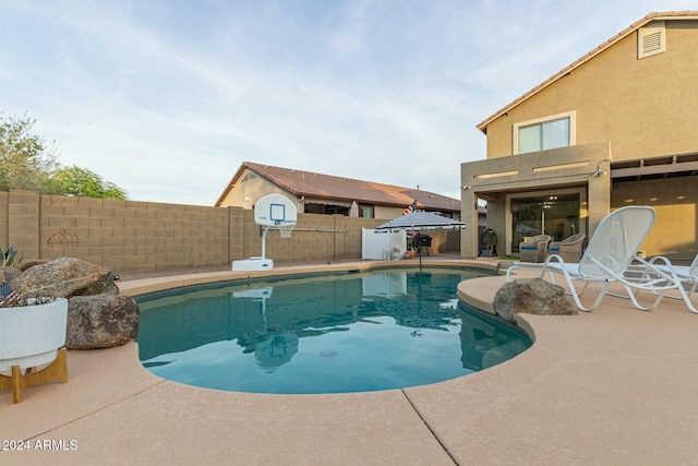 view of pool featuring a patio