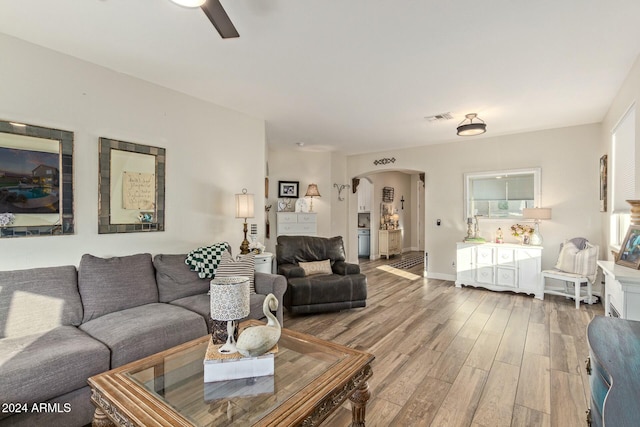 living room with ceiling fan and wood-type flooring