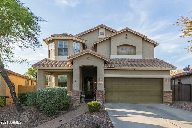 mediterranean / spanish-style home featuring a garage