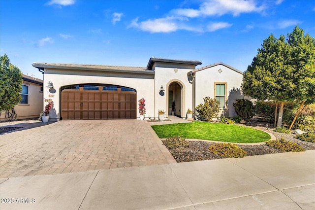 210 E Bergamot Ln, Queen Creek, AZ 85140 - mediterranean / spanish house with a garage, decorative driveway, a front yard, and stucco siding