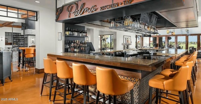 210 E Bergamot Ln, Queen Creek, AZ 85140 - indoor dry bar featuring finished concrete flooring and recessed lighting