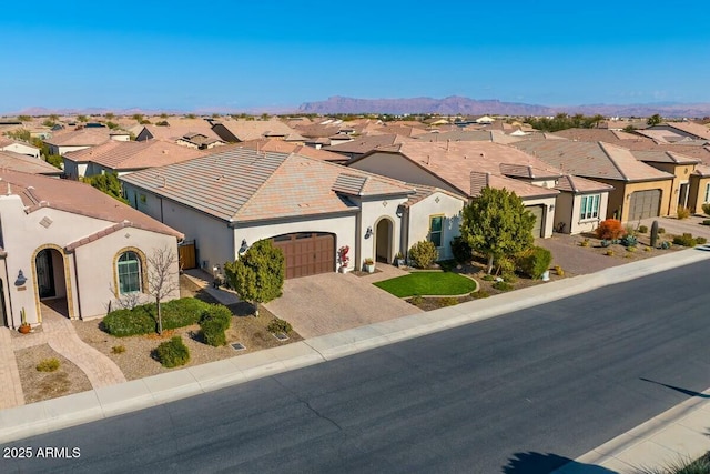 210 E Bergamot Ln, Queen Creek, AZ 85140 - mediterranean / spanish home with a residential view, an attached garage, driveway, and stucco siding