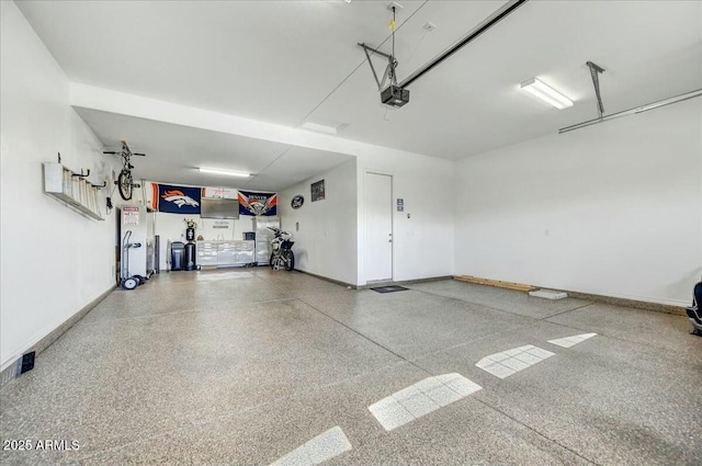210 E Bergamot Ln, Queen Creek, AZ 85140 - garage featuring a garage door opener and baseboards