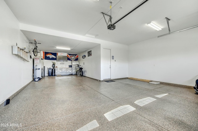210 E Bergamot Ln, Queen Creek, AZ 85140 - garage featuring a garage door opener and baseboards