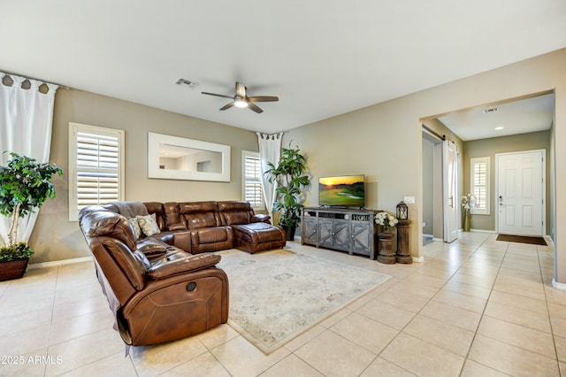 210 E Bergamot Ln, Queen Creek, AZ 85140 - living area with healthy amount of natural light, tile patterned flooring, baseboards, and a ceiling fan