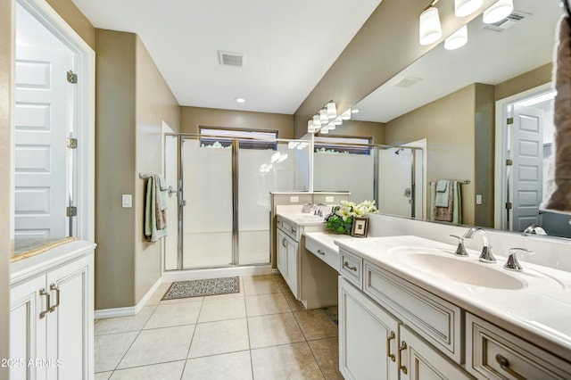 210 E Bergamot Ln, Queen Creek, AZ 85140 - bathroom with a shower stall, two vanities, tile patterned floors, and baseboards