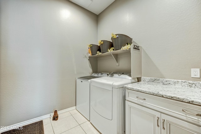 210 E Bergamot Ln, Queen Creek, AZ 85140 - laundry room with washing machine and clothes dryer, cabinet space, light tile patterned flooring, and baseboards