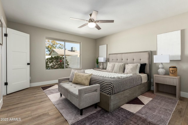 bedroom with hardwood / wood-style flooring and ceiling fan