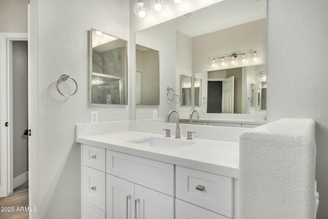 bathroom featuring hardwood / wood-style flooring and vanity