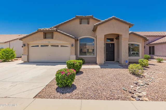 385 E Ironwood Dr, Chandler, AZ 85225 - mediterranean / spanish house with a garage, driveway, stucco siding, and a tile roof