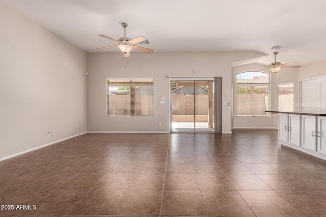 385 E Ironwood Dr, Chandler, AZ 85225 - unfurnished room with a ceiling fan, dark tile patterned flooring, and baseboards