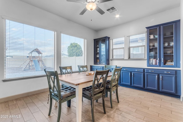 dining space with ceiling fan