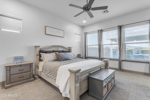 bedroom with light carpet and ceiling fan