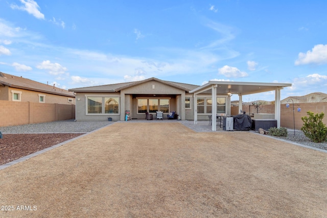 rear view of property featuring a patio area and central air condition unit