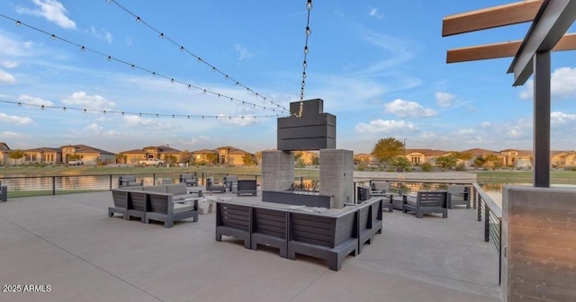 view of patio / terrace with an outdoor living space with a fireplace