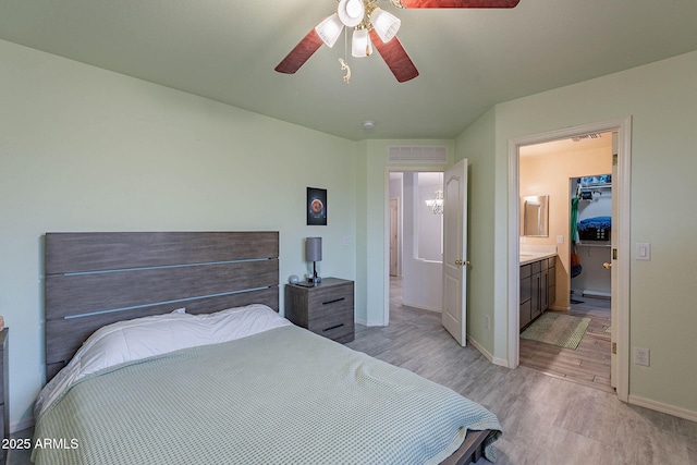 bedroom with ceiling fan and light hardwood / wood-style floors