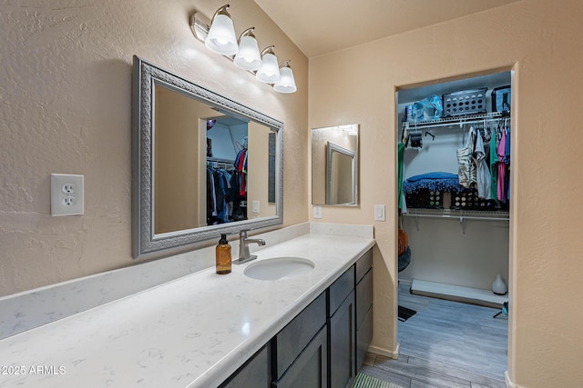 bathroom featuring vanity and hardwood / wood-style floors