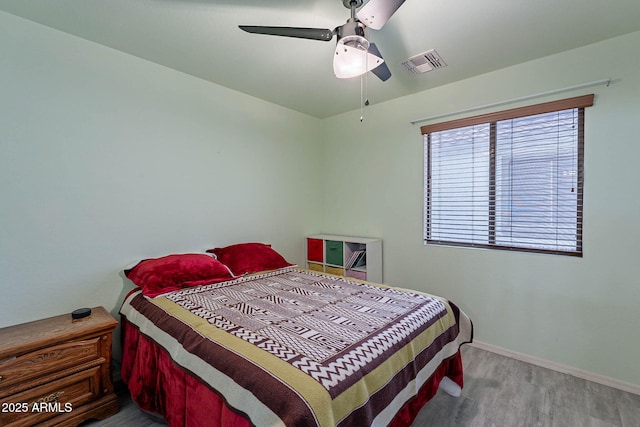 bedroom featuring wood-type flooring and ceiling fan