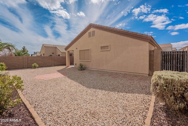 rear view of house featuring a patio area