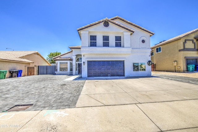1853 N Rowen Cir, Mesa, AZ 85207 - mediterranean / spanish-style home featuring concrete driveway, a garage, stucco siding, and a tiled roof