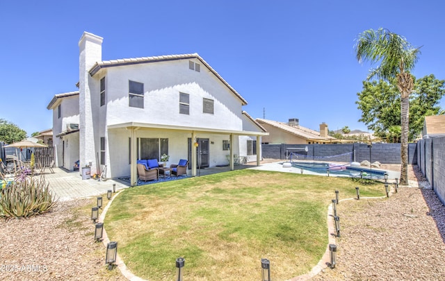 1853 N Rowen Cir, Mesa, AZ 85207 - rear view of house with a chimney, a fenced backyard, stucco siding, and a patio