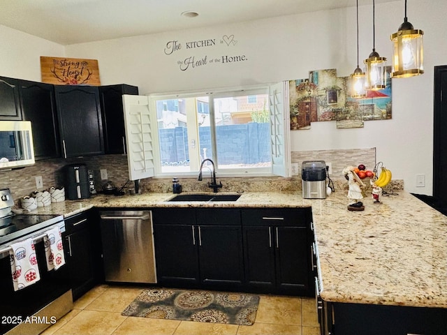 1853 N Rowen Cir, Mesa, AZ 85207 - kitchen with appliances with stainless steel finishes, dark cabinets, and light tile patterned floors