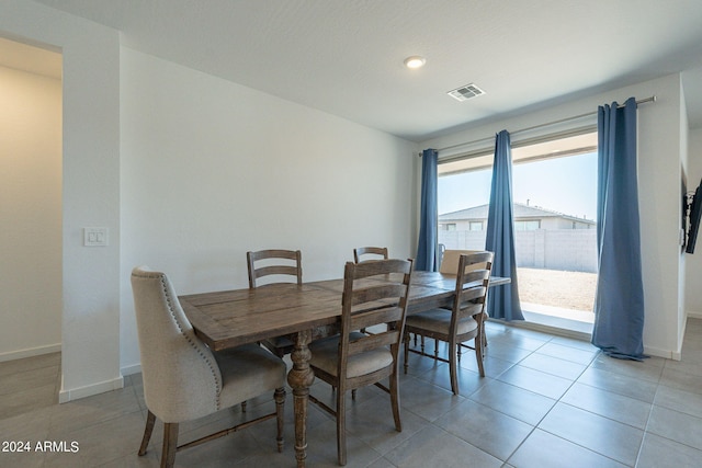 dining area featuring light tile patterned flooring