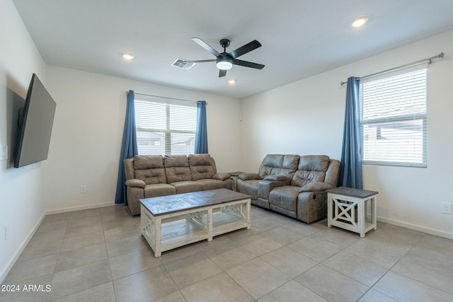 tiled living room featuring ceiling fan