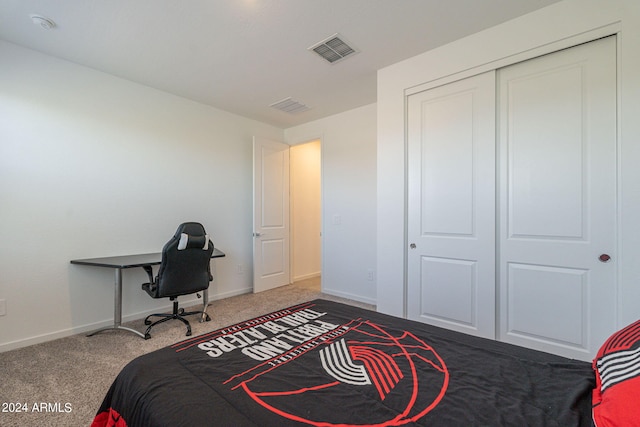 bedroom with a closet and dark colored carpet