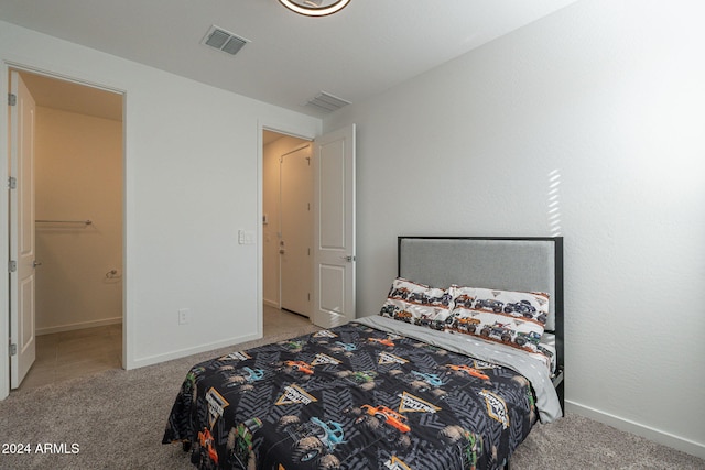 bedroom featuring light carpet