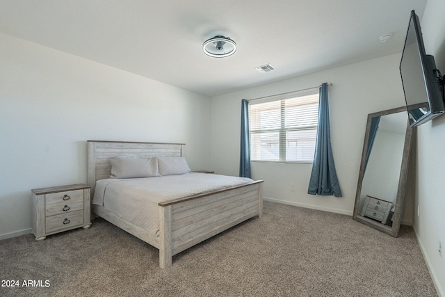 bedroom with light colored carpet