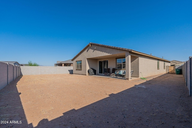 back of house with a patio area