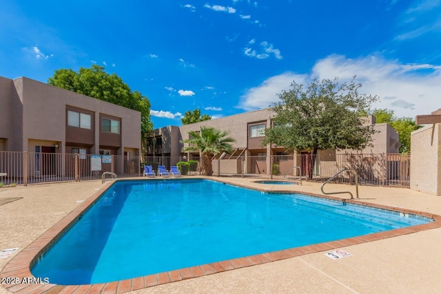 811 W 13th St, Tempe, AZ 85281 - community pool featuring fence, a community hot tub, a residential view, and a patio area