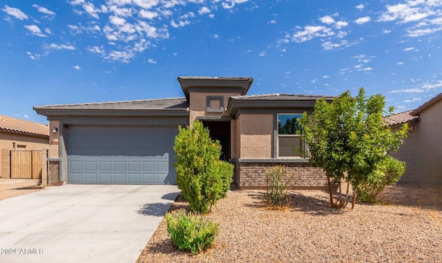 prairie-style house featuring a garage