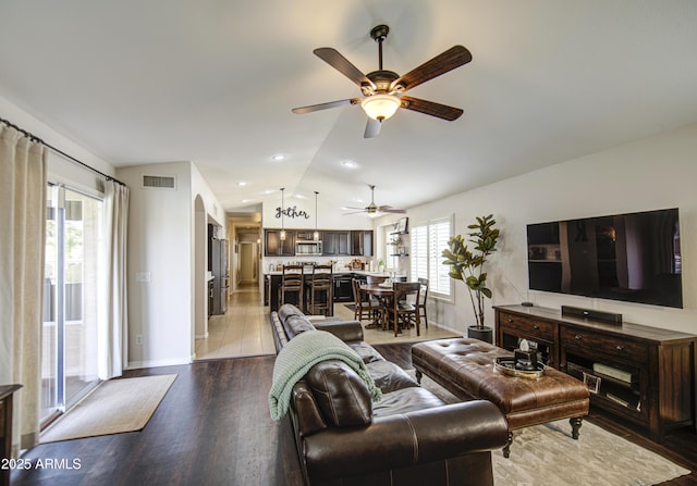 1217 S Longmore Ct, Chandler, AZ 85286 - living area featuring ceiling fan, wood finished floors, vaulted ceiling, and baseboards