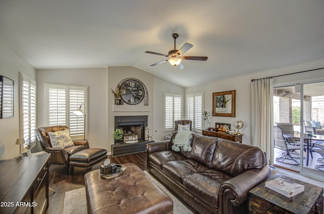 1217 S Longmore Ct, Chandler, AZ 85286 - living area with wood finished floors, a ceiling fan, lofted ceiling, and a fireplace with raised hearth