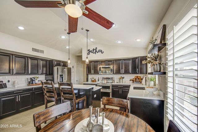 1217 S Longmore Ct, Chandler, AZ 85286 - dining space with a ceiling fan, lofted ceiling, and recessed lighting
