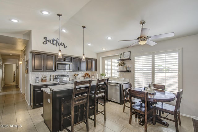 1217 S Longmore Ct, Chandler, AZ 85286 - kitchen featuring stainless steel appliances, light countertops, a ceiling fan, backsplash, and open shelves