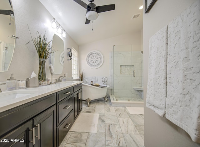 1217 S Longmore Ct, Chandler, AZ 85286 - full bathroom with a soaking tub, marble look tiles, lofted ceiling, ceiling fan, and double vanity