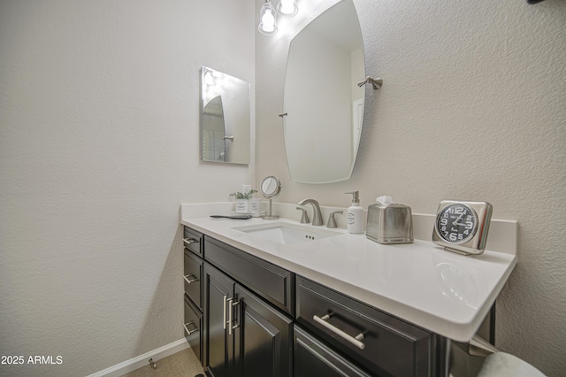 1217 S Longmore Ct, Chandler, AZ 85286 - bathroom with vanity, a textured wall, and baseboards