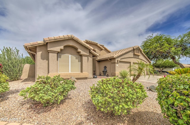 1217 S Longmore Ct, Chandler, AZ 85286 - mediterranean / spanish house with stucco siding, a garage, and a tiled roof
