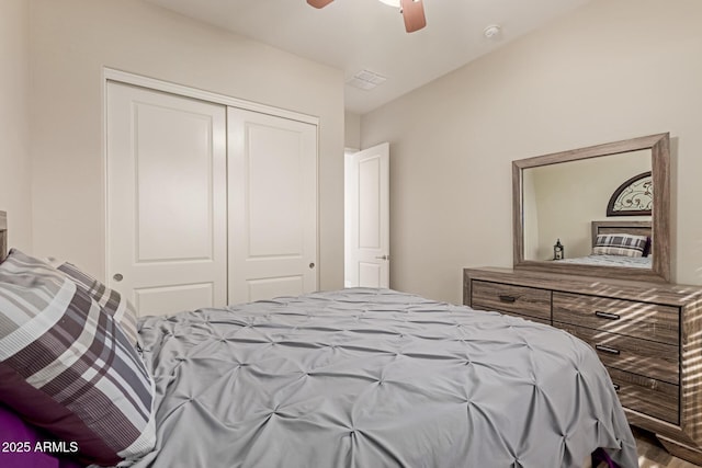 bedroom with ceiling fan and a closet