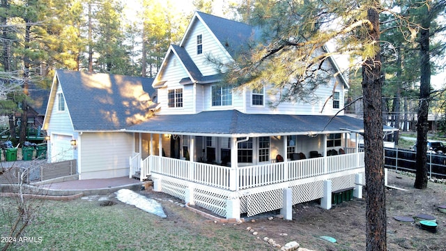 view of front facade with a garage and covered porch