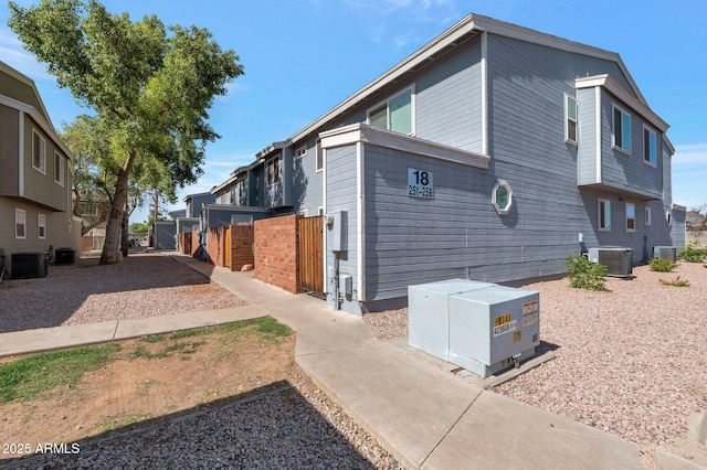 2301 E University Dr Unit 256, Mesa, AZ 85213 - view of property exterior with central AC and a gate