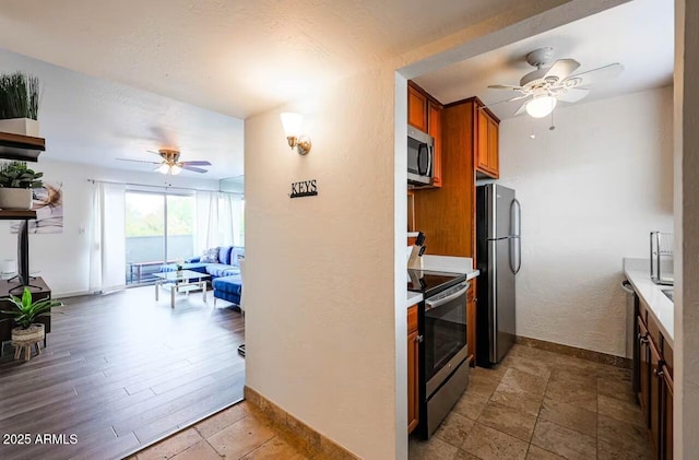 kitchen with stainless steel appliances and ceiling fan