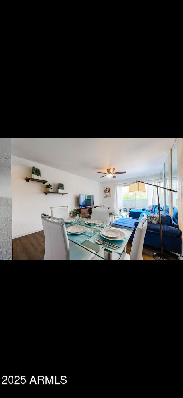 dining room with hardwood / wood-style flooring and ceiling fan