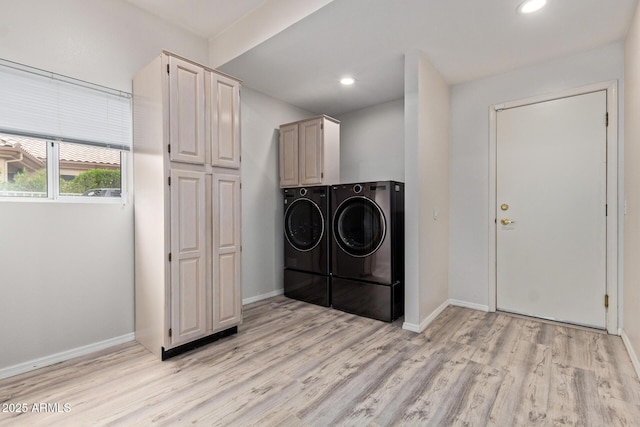 washroom featuring light wood-style flooring, recessed lighting, baseboards, and independent washer and dryer