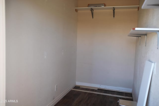 spacious closet with wood finished floors